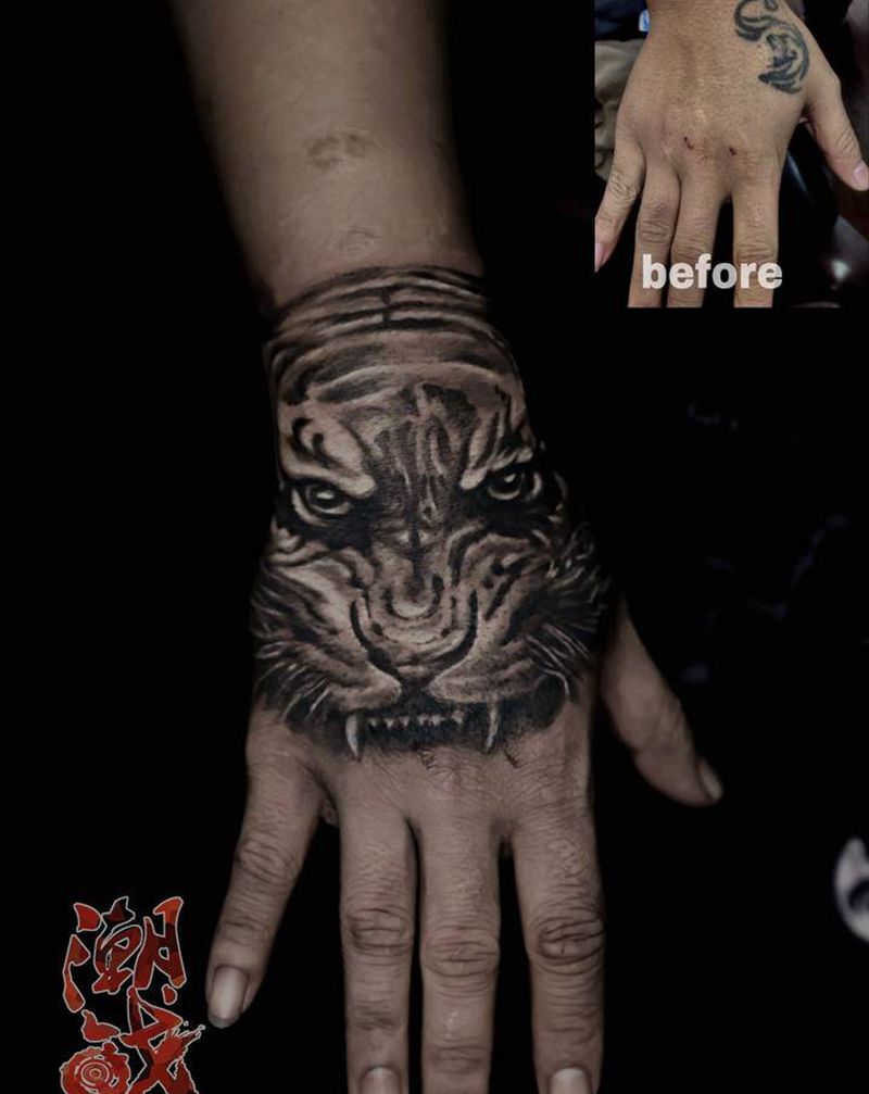 纹身遮盖纹身图片_手部欧美写实老虎遮盖纹身图案