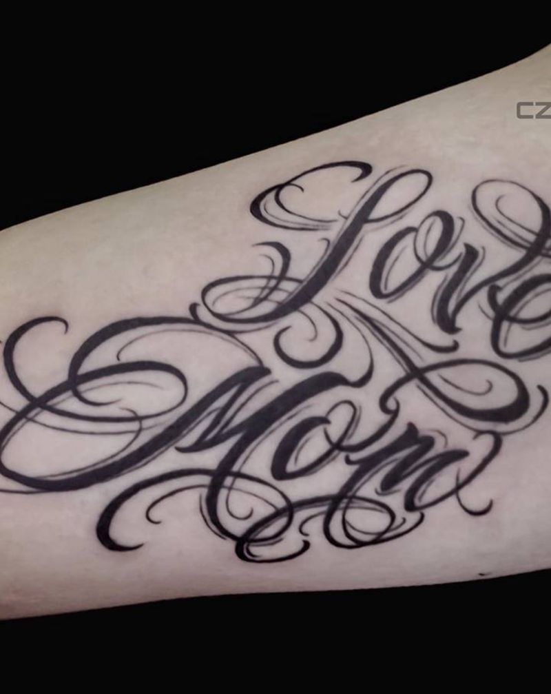 花体字纹身图片_手臂花体字纹身图案