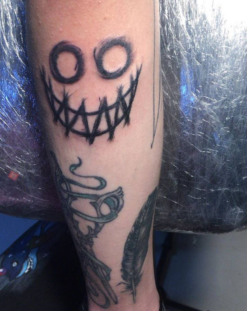 笑纹身图片_手臂纹身图案