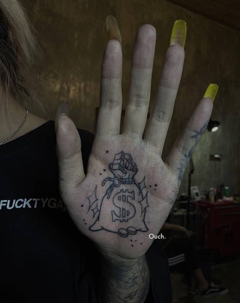 钱袋纹身图片_手部纹身图案