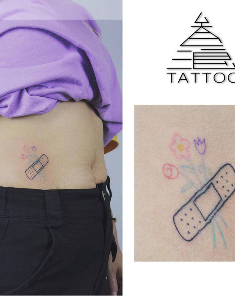 创可贴纹身图片_腹部纹身图案