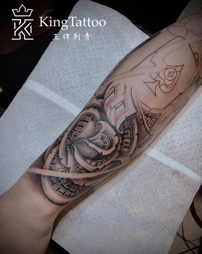 写实花臂，未完待续纹身图片_手臂手部欧美写实钞票花美元纹身图案