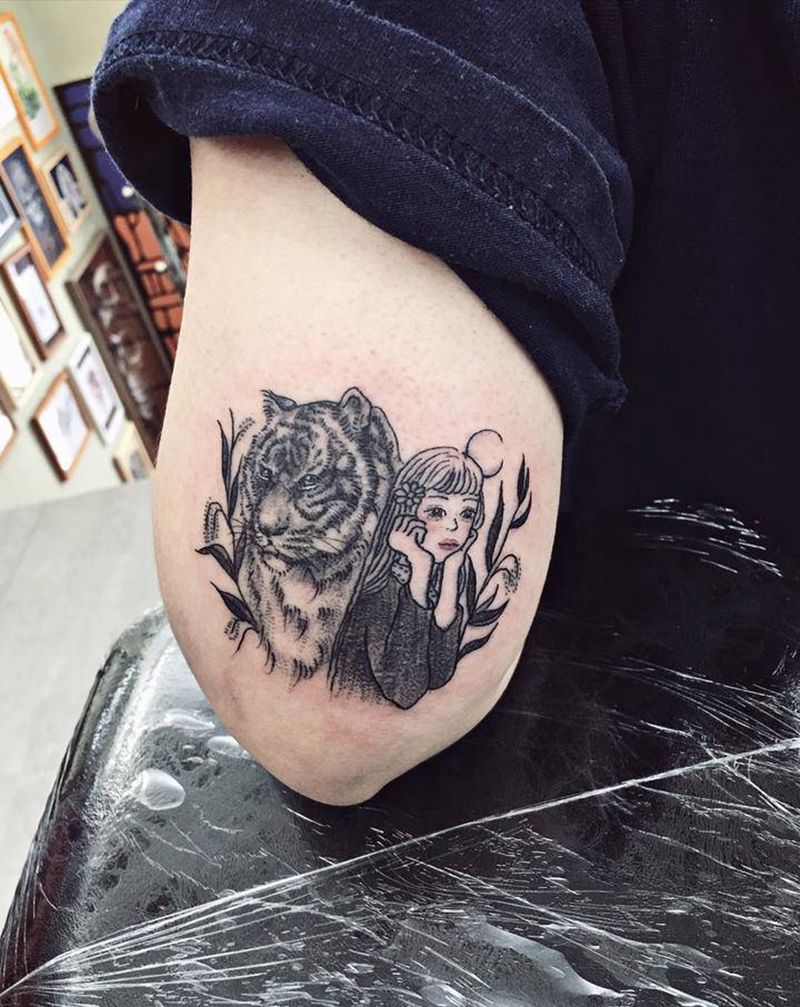 老虎女孩纹身图片_手臂纹身图案