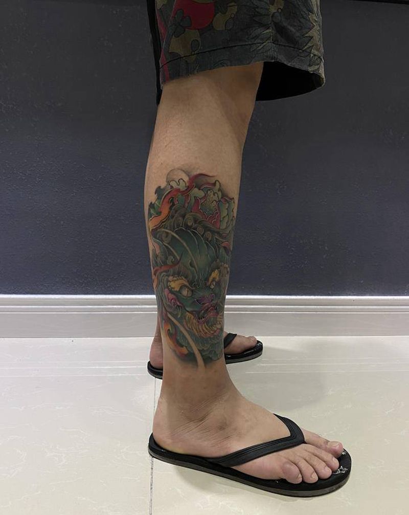 福狮纹身图片_腿部新传统纹身图案