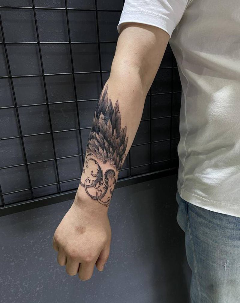 翅膀覆盖纹身图片_手臂新传统纹身图案