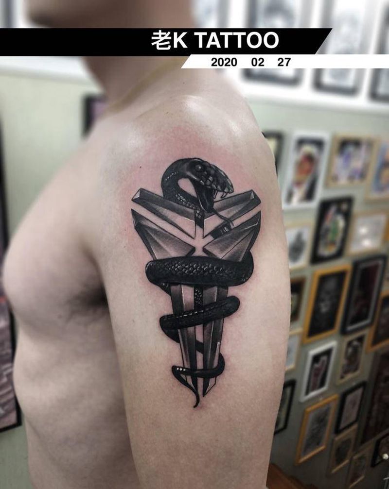 曼巴精神纹身图片_手臂欧美写实纹身图案