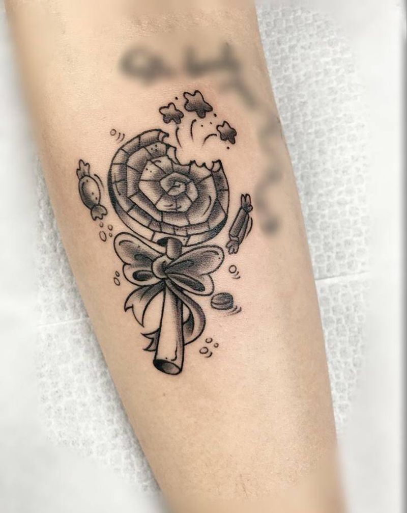 棒棒糖纹身图片_手臂纹身图案