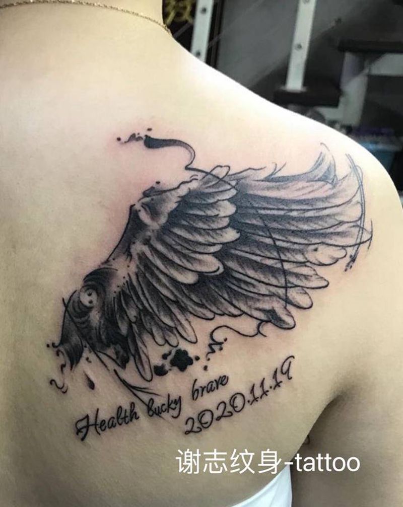 水墨翅膀纹身图片_背部水墨纹身图案