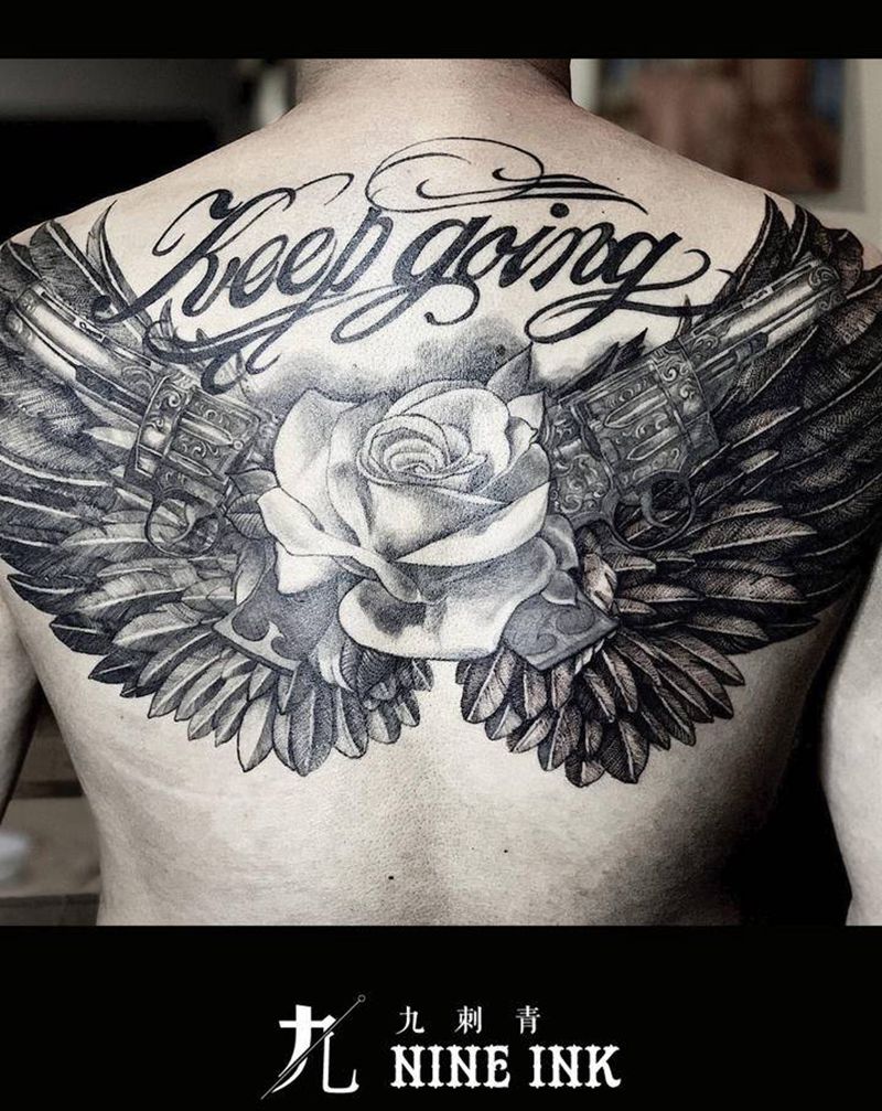 Gun&rose纹身图片_背部欧美写实纹身图案