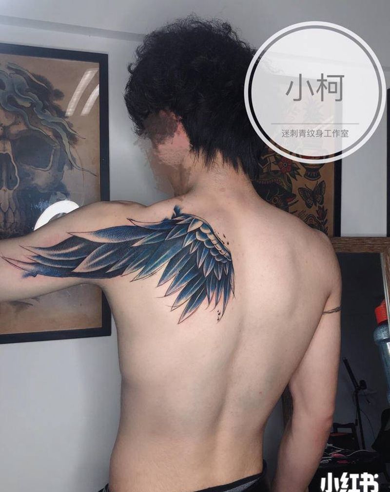 泼墨翅膀纹身图片_背部手臂水墨欧美写实翅膀纹身图案