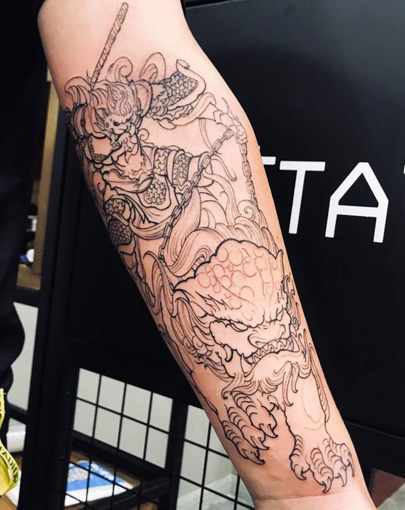 驭狮纹身图片_手臂大圣唐狮猴子纹身图案