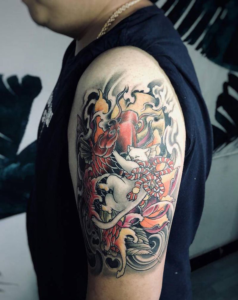 猫骑鱼纹身图片_手臂纹身图案