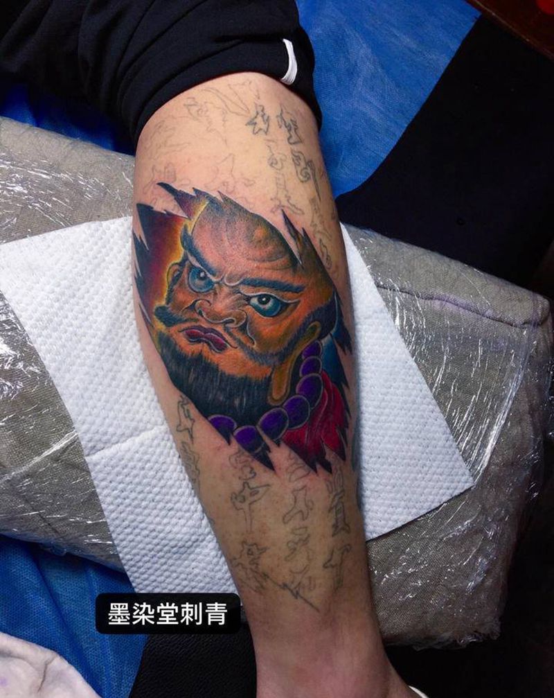小腿修改达摩纹身图片_腿部纹身图案