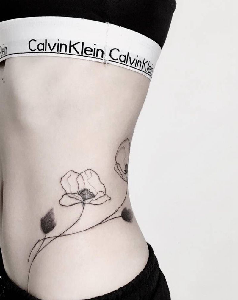 花纹身图片_腰部纹身图案