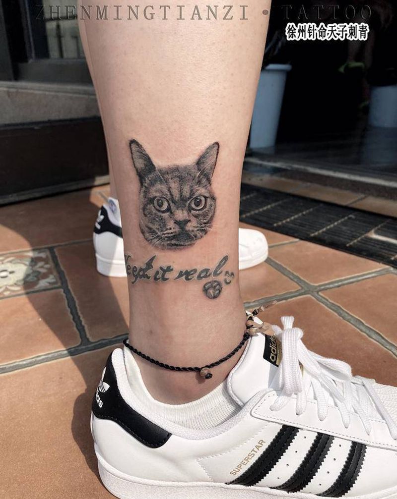 猫咪纹身图片_腿部欧美写实纹身图案