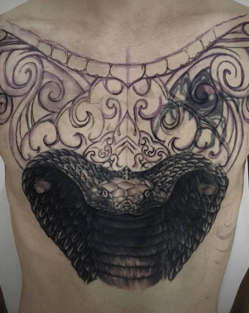 未完待续纹身图片_胸部欧美写实蛇石雕纹身图案