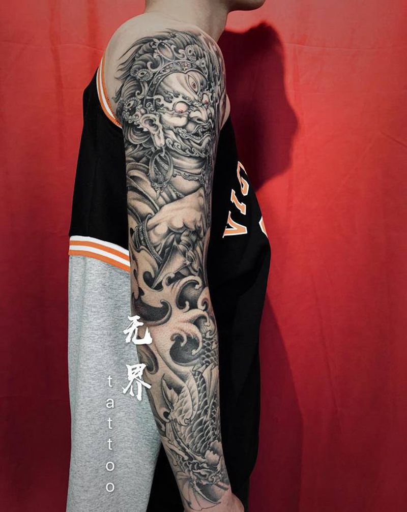 新传统花臂纹身图片_手臂新传统大黑天鳌鱼花臂纹身图案