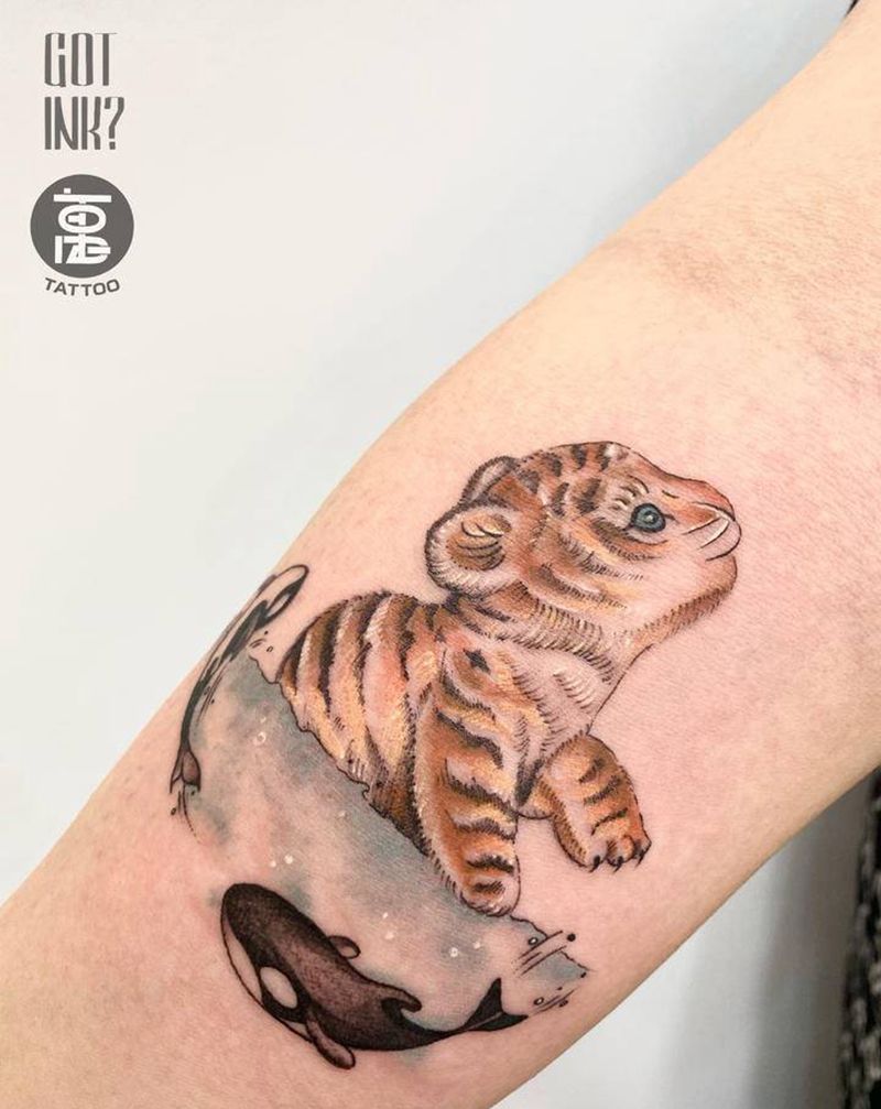小脑斧与鱼纹身图片_手臂水彩鱼老虎纹身图案