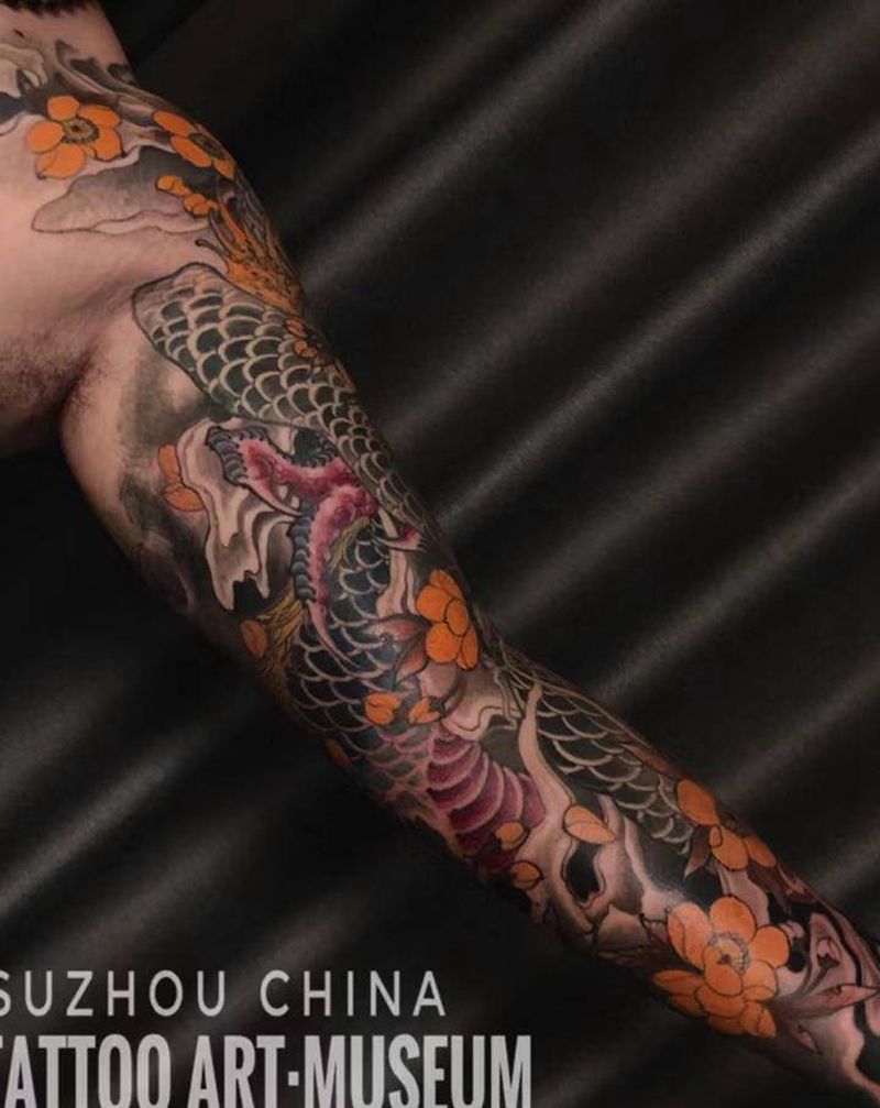 新传统龍纹身图片_手臂新传统纹身图案