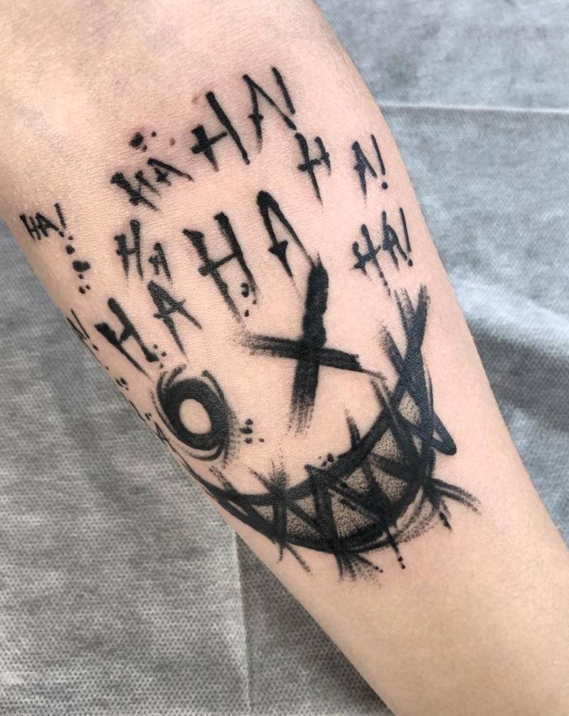 鬼笑脸纹身图片_手臂纹身图案