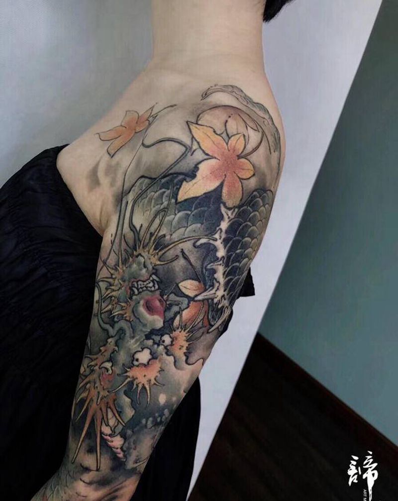 传统龙花臂纹身图片_手臂新传统纹身图案