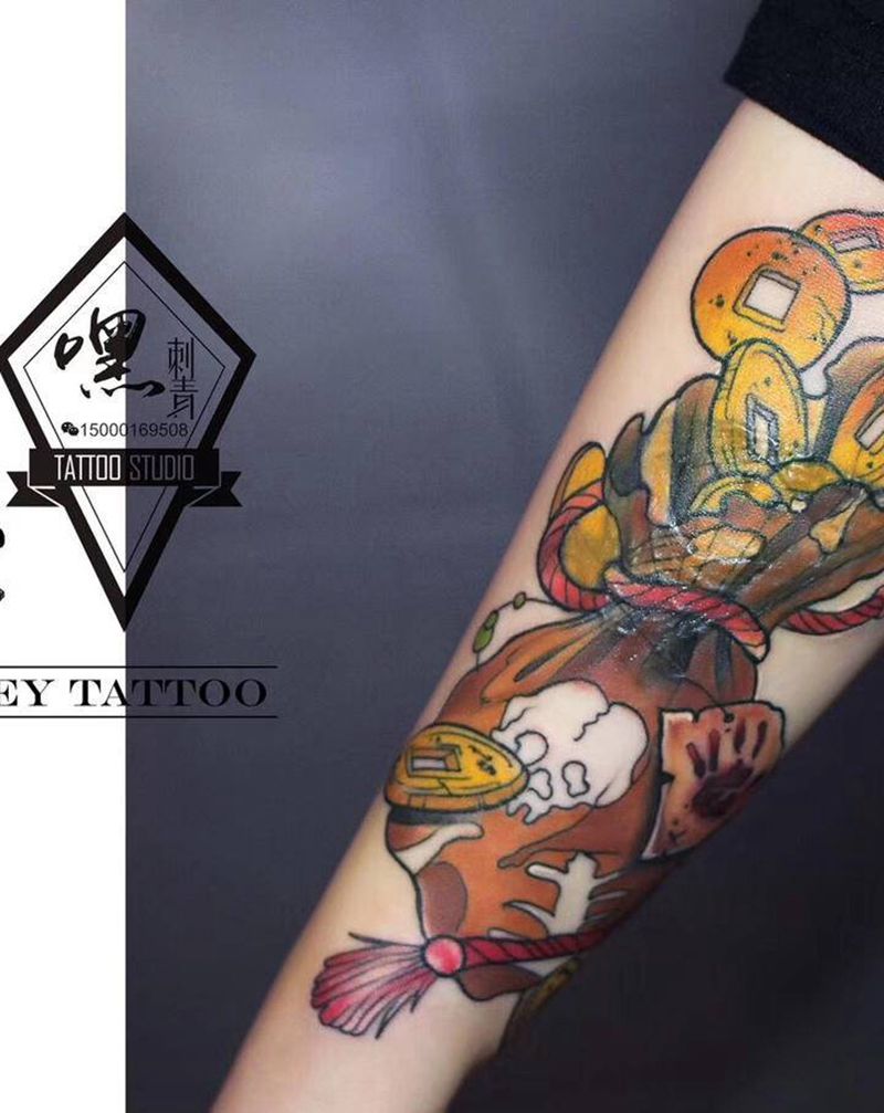 钱袋 遮盖纹身图片_手臂纹身图案