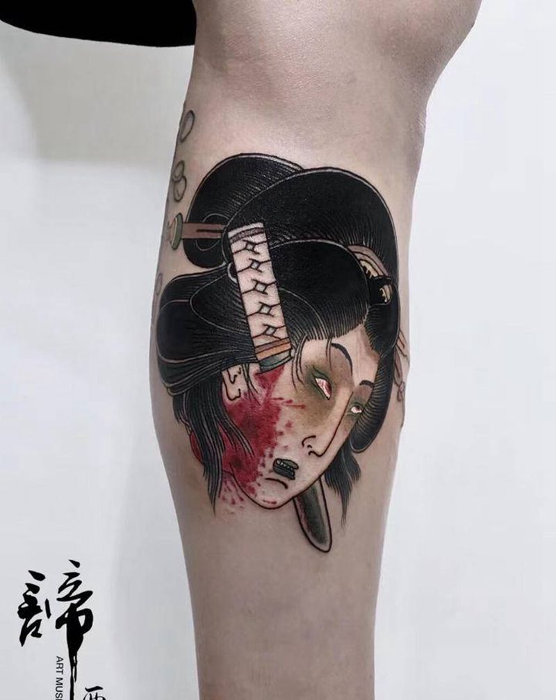 生首纹身图片_腿部老传统纹身图案