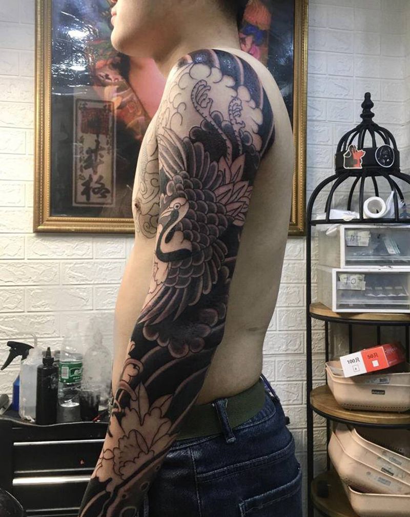 老传统鹤花臂纹身图片_手臂腿部老传统新传统鹤牡丹纹身图案