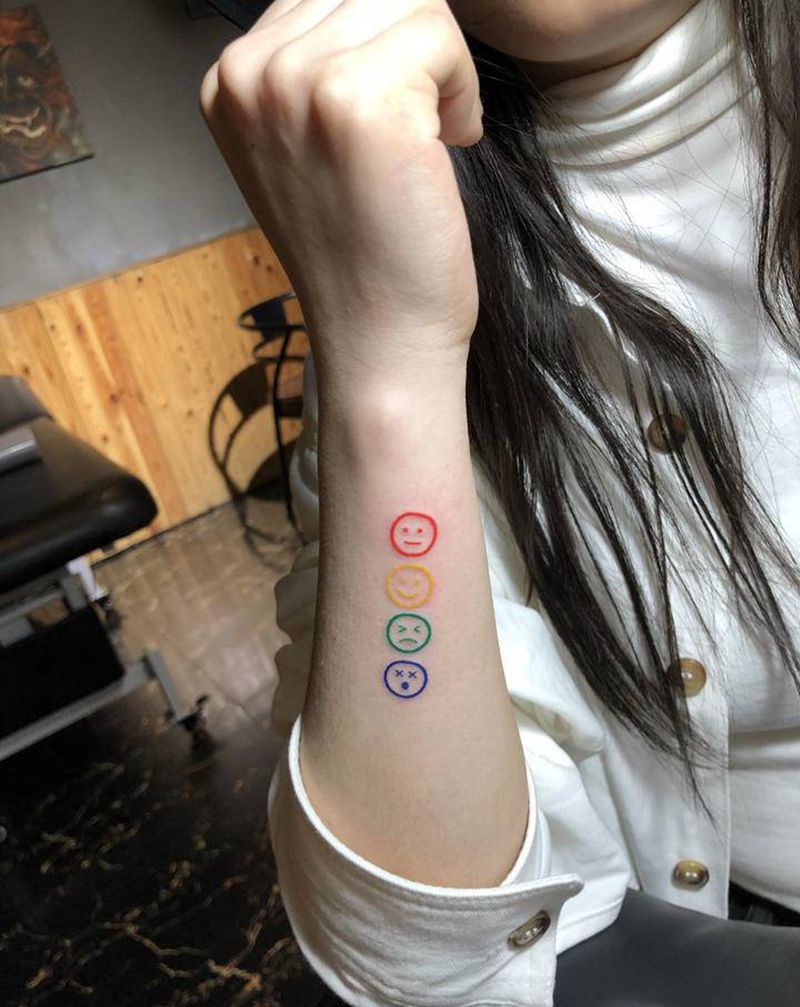 彩色喜怒哀乐纹身纹身图片_手臂纹身图案