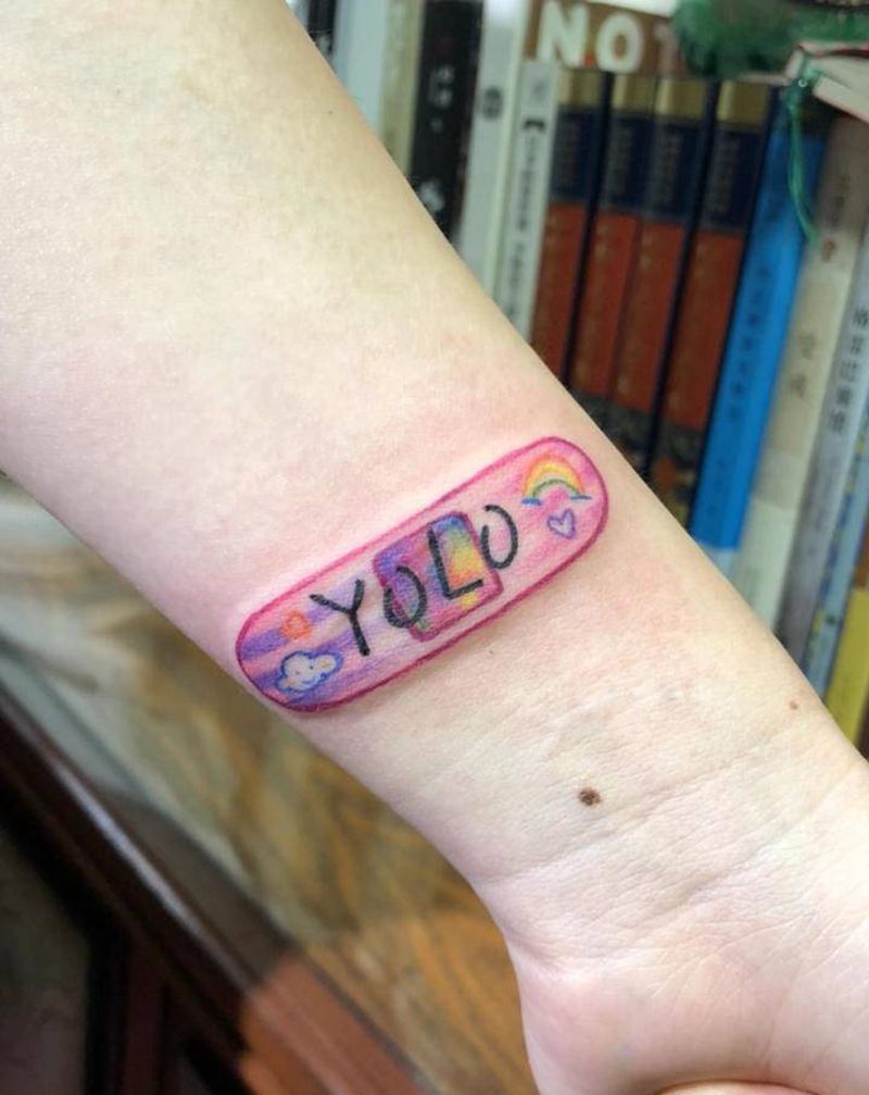 创可贴纹身图片_手臂水彩纹身图案