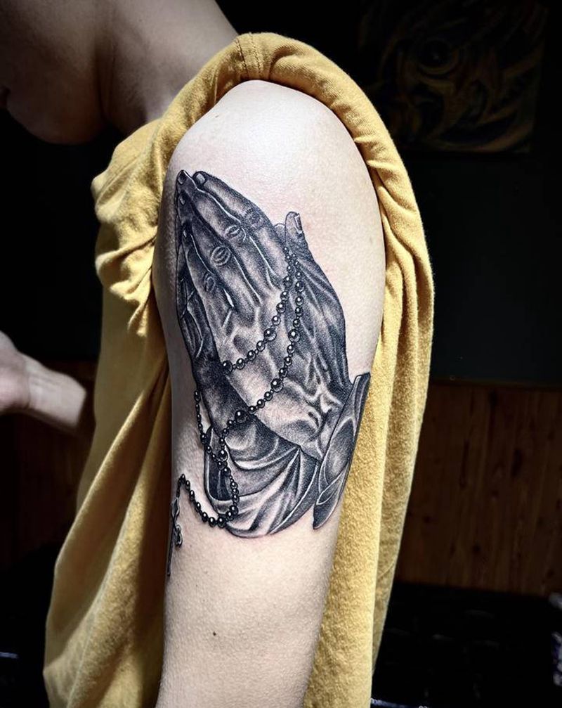 祈祷之手纹身图片_手臂背部欧美写实纹身图案