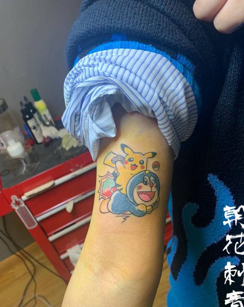 哆啦纹身图片_手臂New SchoolOld School纹身图案