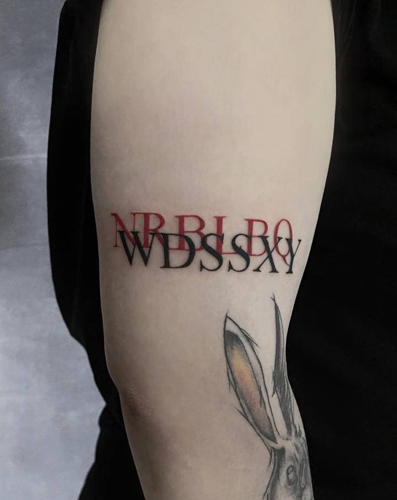 字母纹身图片_手臂花体字纹身图案