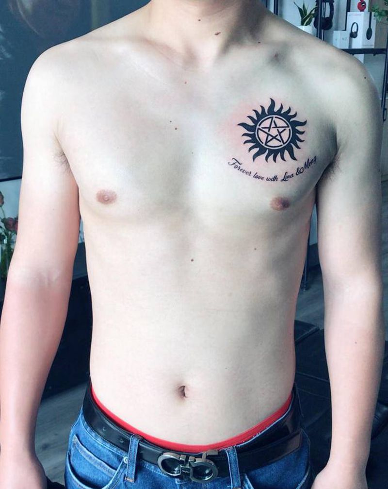 心中太阳纹身图片_胸部图腾纹身图案