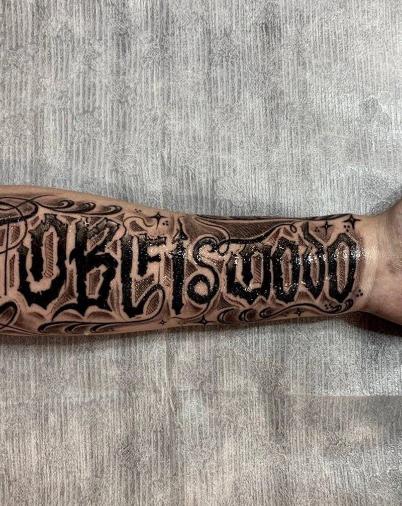 酷纹身图片_手臂花体字纹身图案