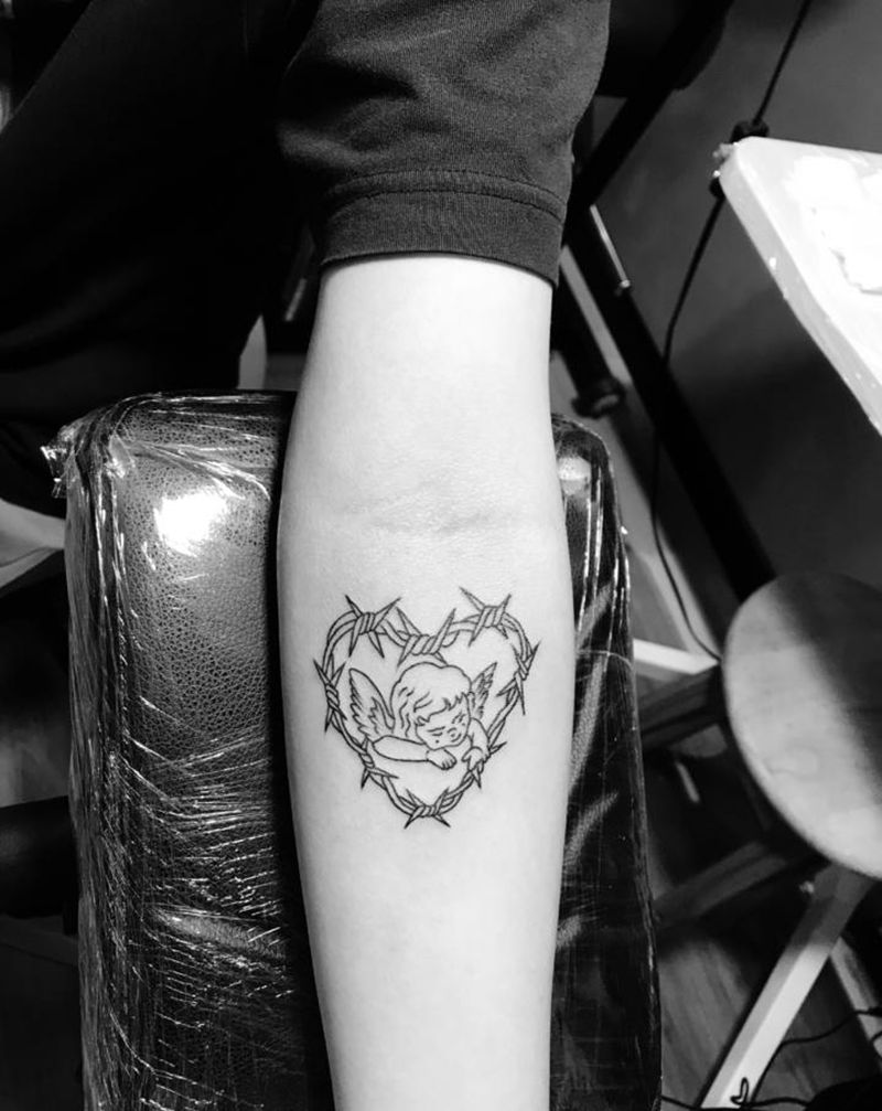 小图一枚纹身图片_手臂纹身图案