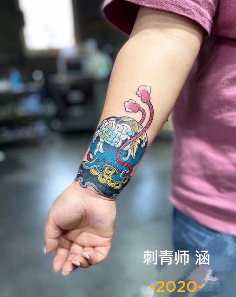 福袋遮盖旧纹身纹身图片_手臂日式福袋遮盖纹身图案