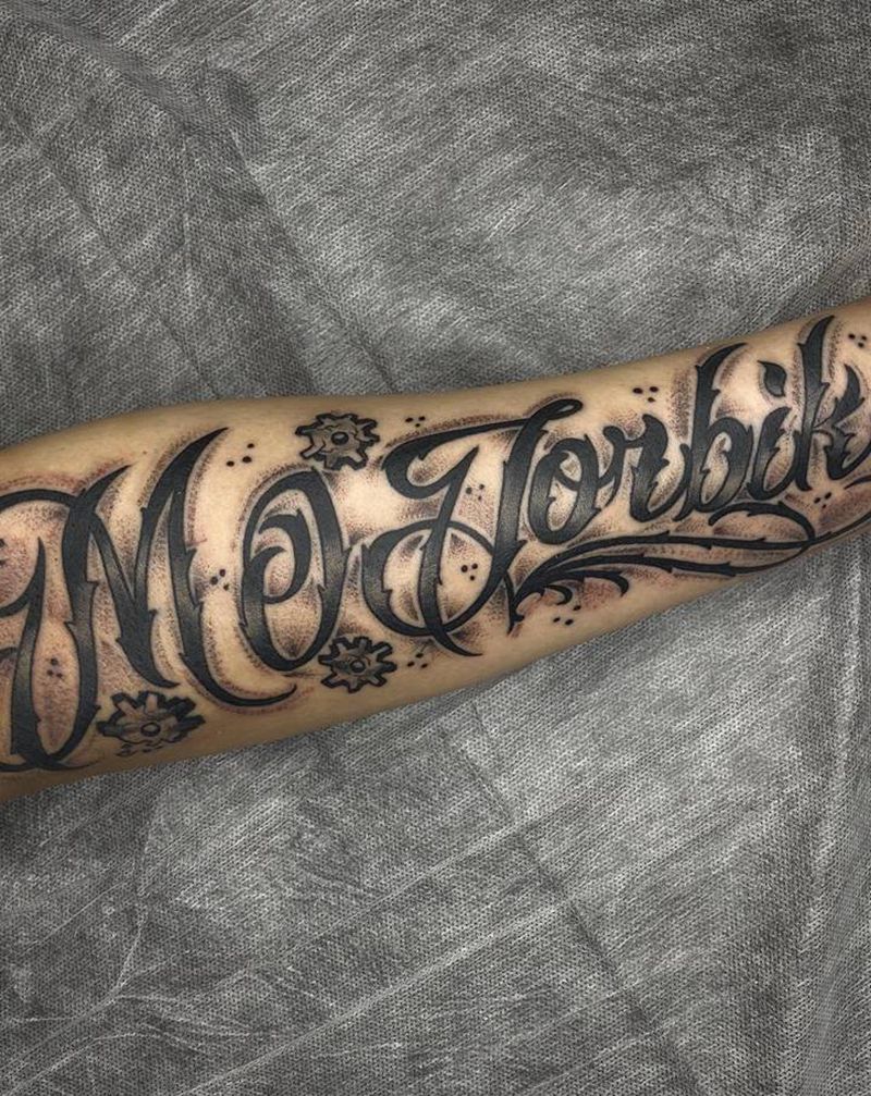 设计纹身图片_手臂花体字纹身图案