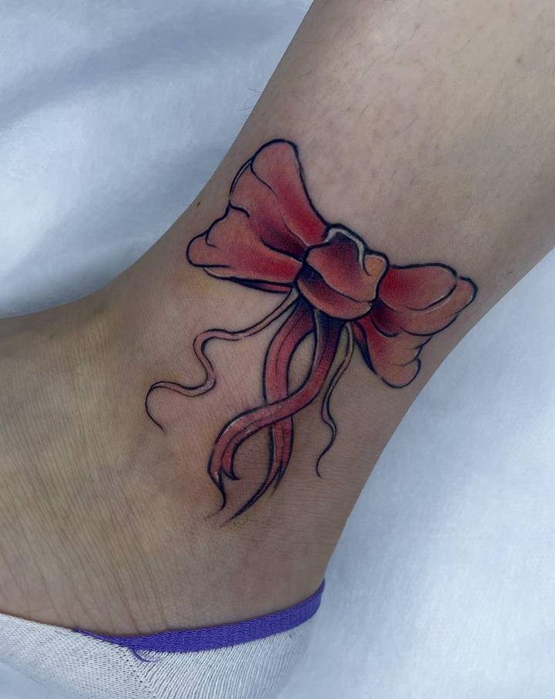 蝴蝶结遮盖纹身图片_腿部纹身图案