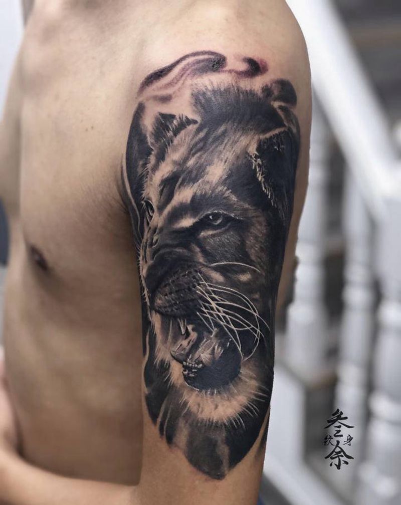 狮子纹身图片_手臂欧美写实纹身图案