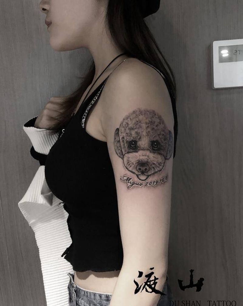 设计狗狗纹身图片_手臂欧美写实狗狗纹身图案