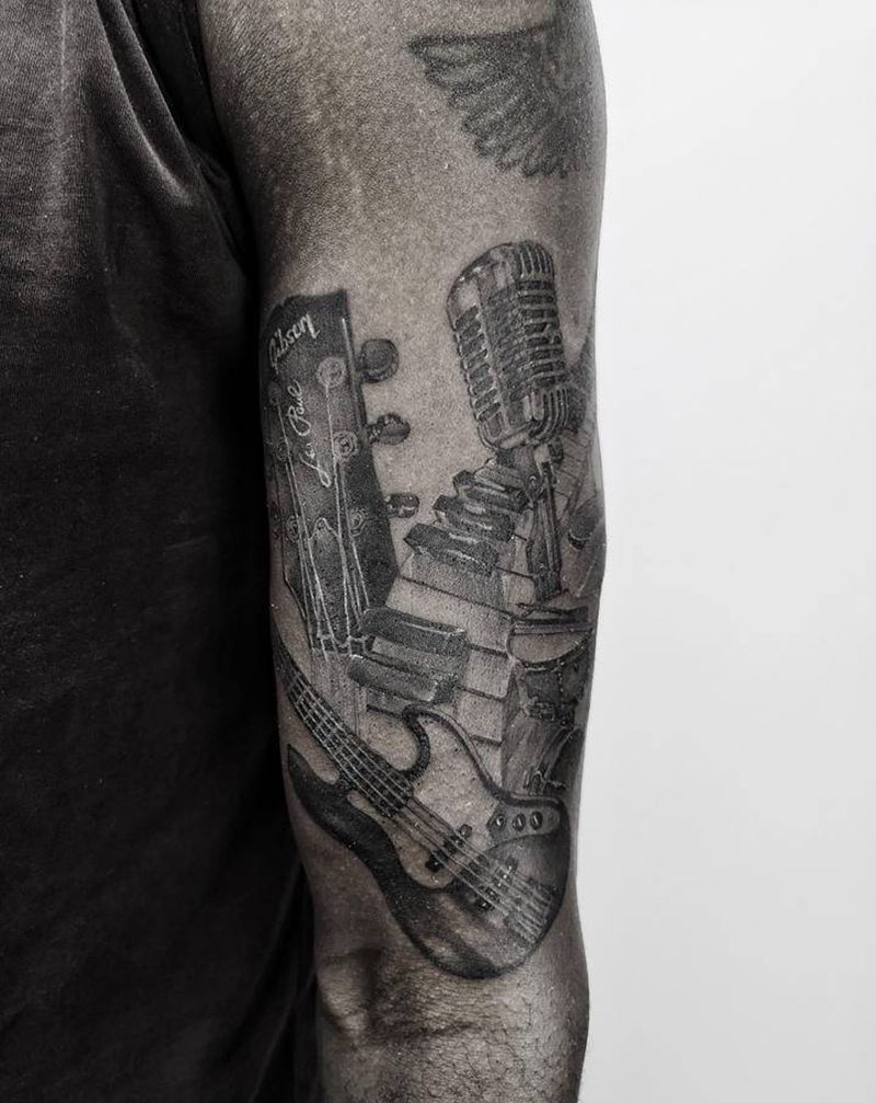 乐器纹身图片_手臂欧美写实纹身图案