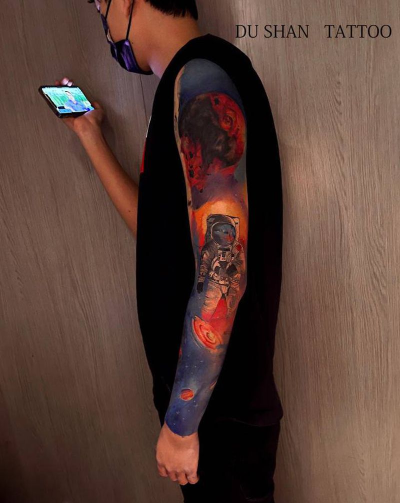 星空花臂纹身图片_手臂水彩星空纹身图案