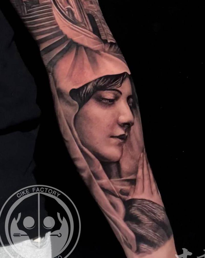 修女祈祷纹身图片_手臂欧美写实纹身图案