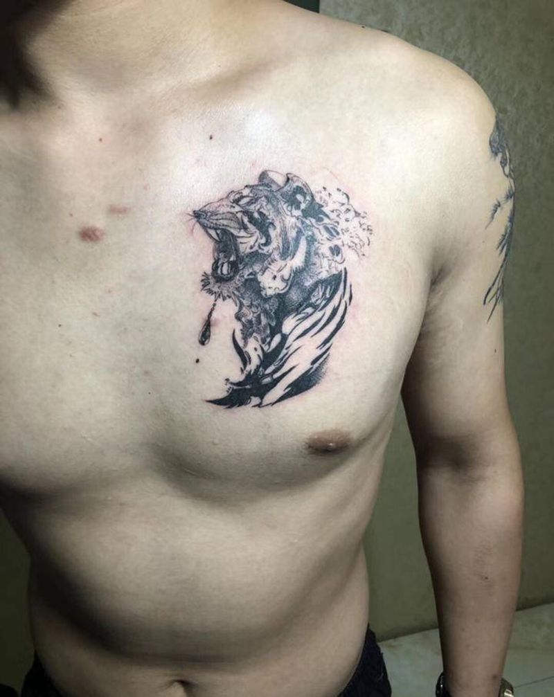 老虎头纹身图片_胸部图腾点刺纹身图案