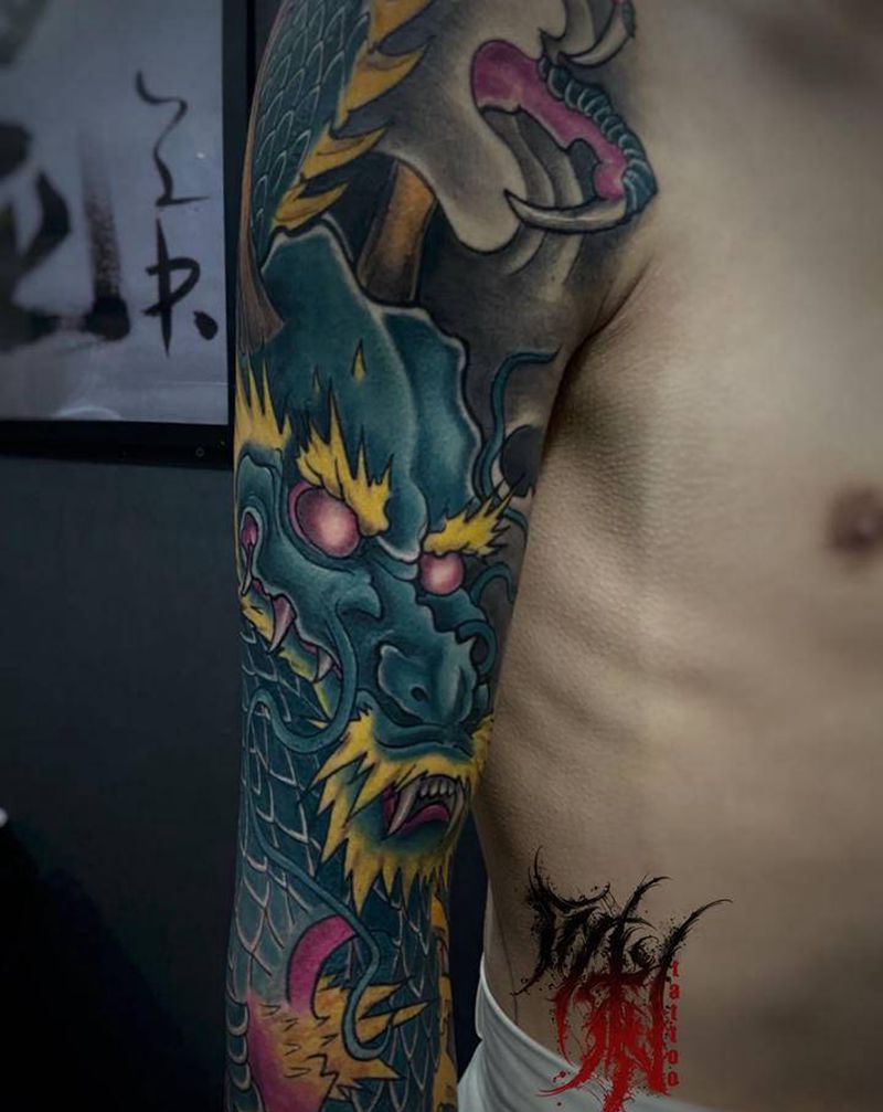 花臂龙纹身图片_手臂新传统纹身图案