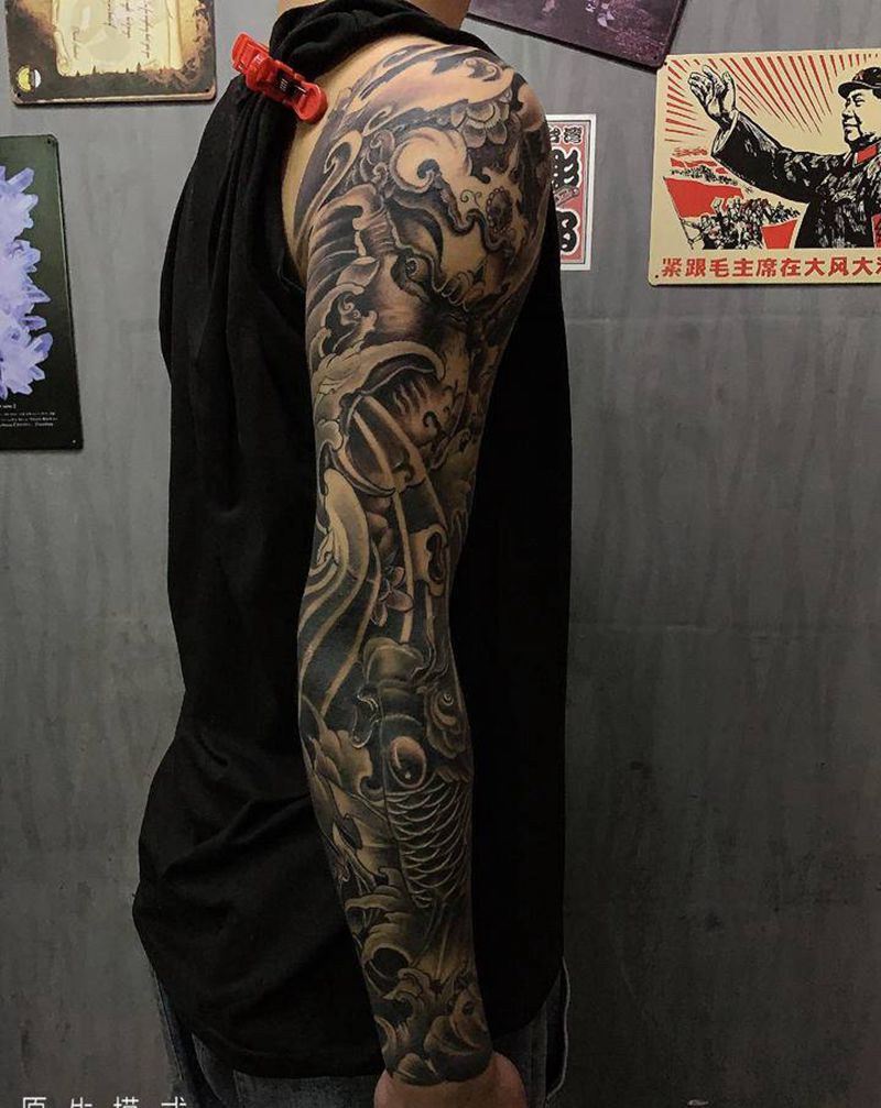 花臂纹身图片_手臂新传统象神与鱼纹身图案