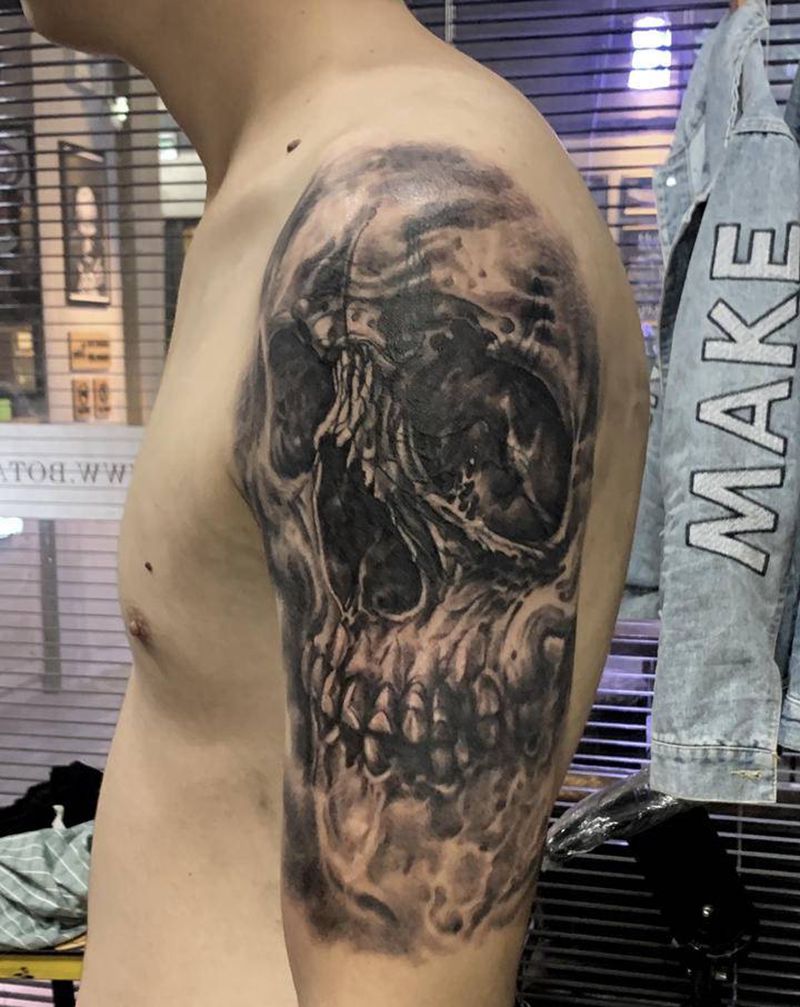 遮盖骷髅纹身图片_手臂欧美写实纹身图案