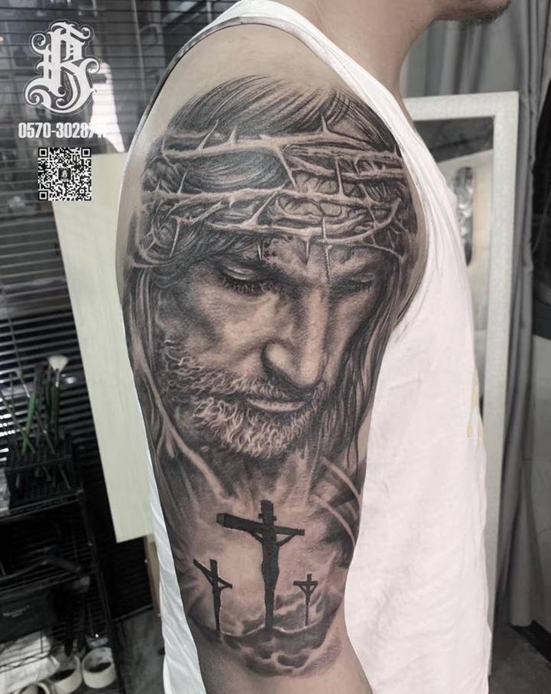 耶稣纹身图片_手臂欧美写实纹身图案