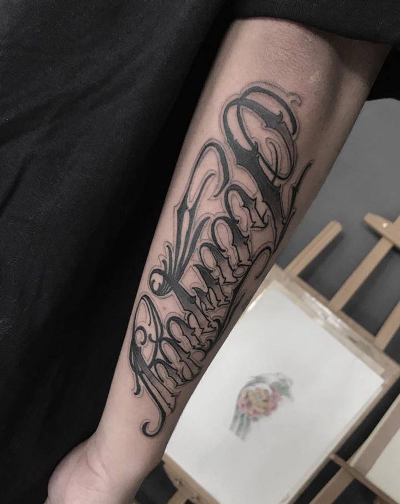 花体字纹身图片_手臂纹身图案